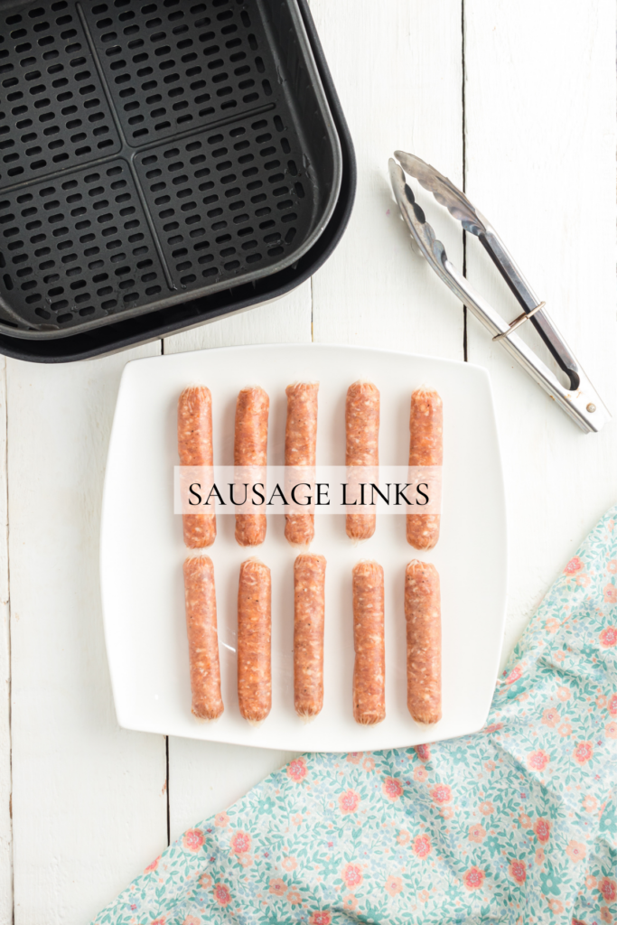 Sausage links on a plate ready to go in the air fryer.