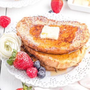 French toast with sourdough on a plate with berries.