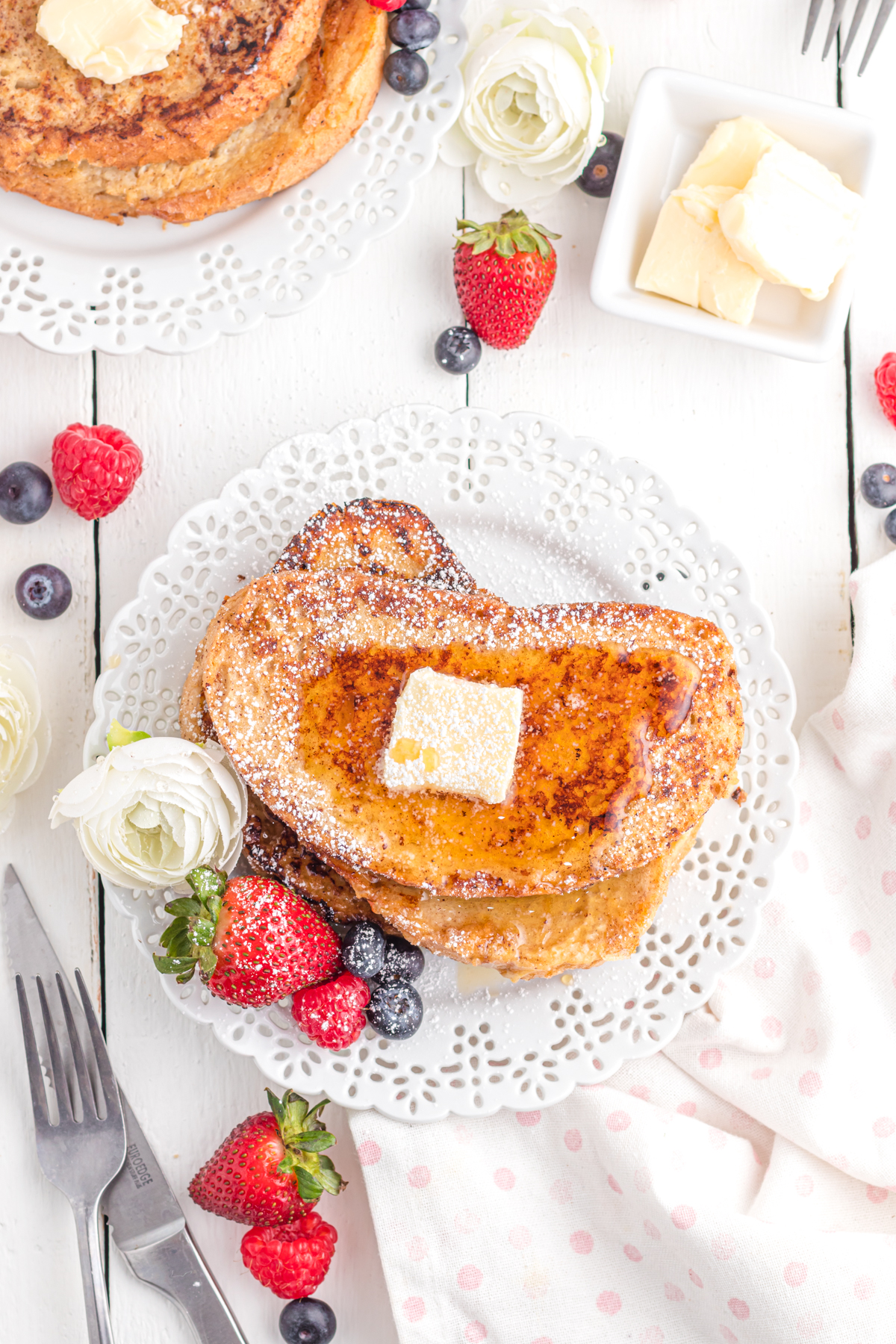 Sourdough French toast on plate with berries.