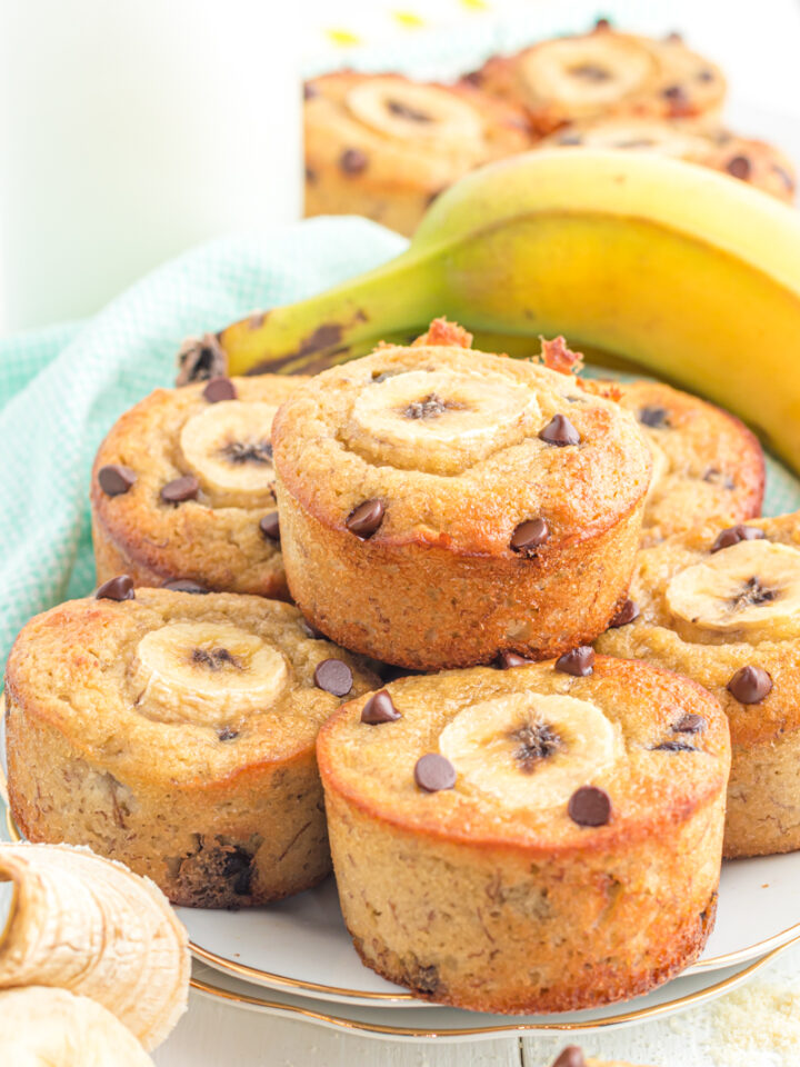 Banana muffins with almond flour stacked on a plate.