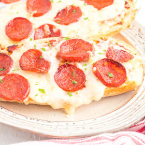Air fryer french bread pizza on plate.