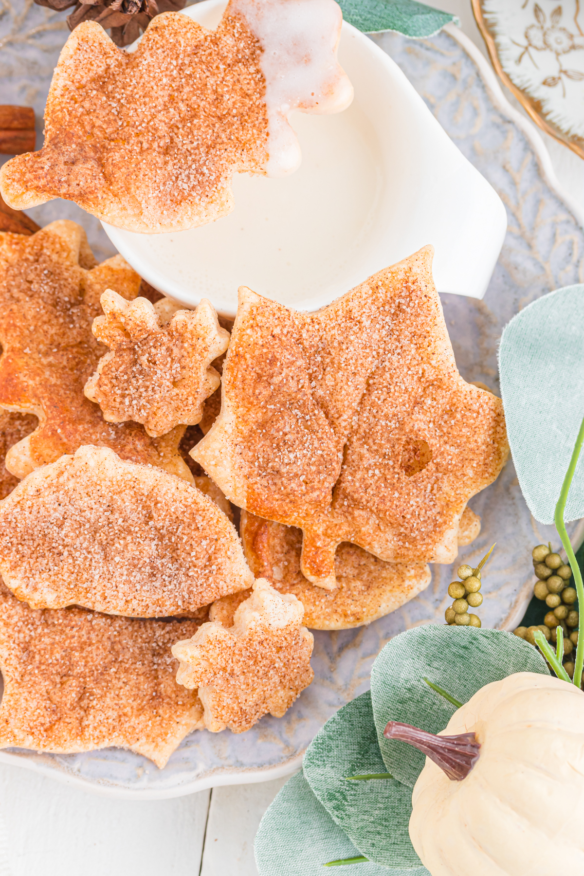 Leaf shaped cookies on a plate with dip.
