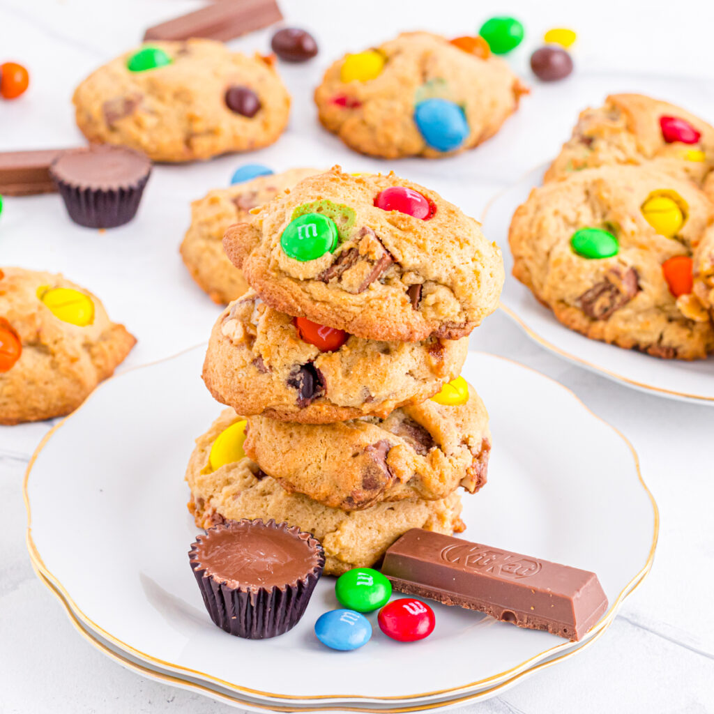 Candy bar cookies stacked on plate.