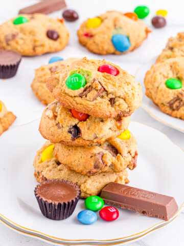 Candy bar cookies stacked on plate.