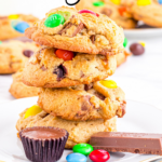 Cookies with candy stacked on plate.