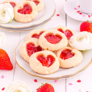 Heart cookies on table with strwberries.