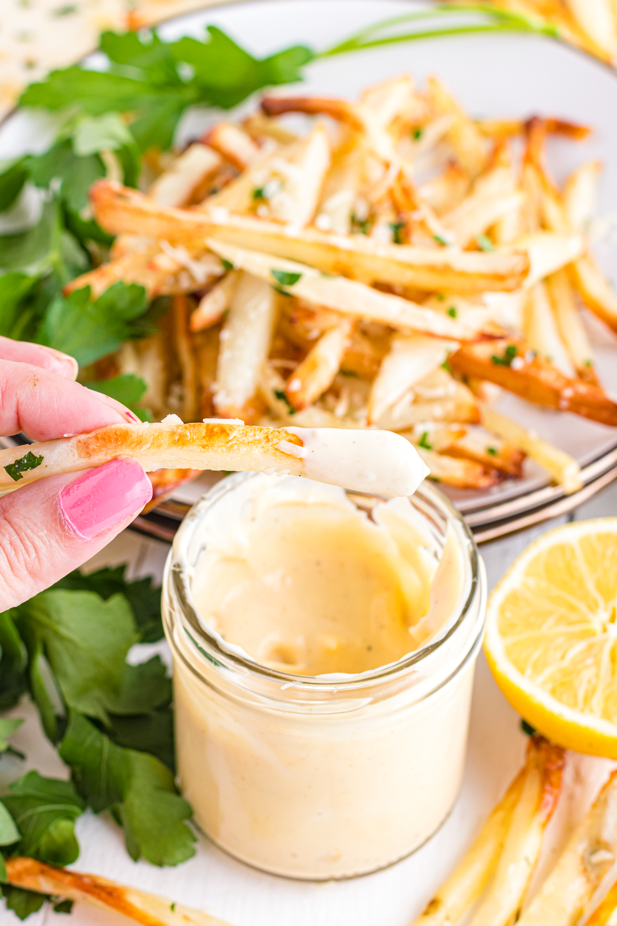 Dipping fries in aioli.