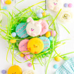 Easter Oreos on plate with Easter grass and eggs.