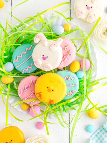 Easter Oreos on plate with Easter grass and eggs.