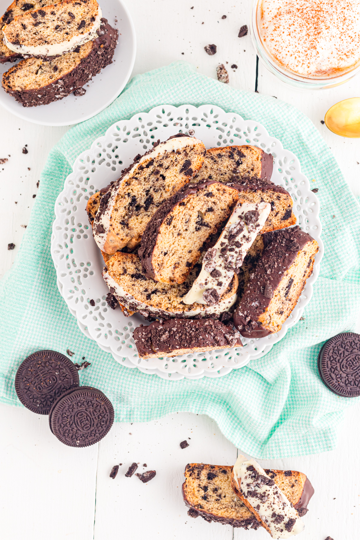 Oreo Biscotti on a plate with crumbs on the table.
