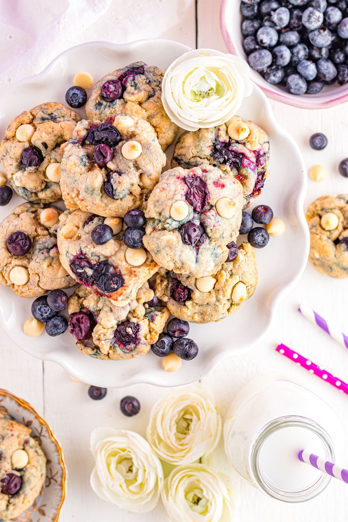 Platter of blueberry cookies with white chocolate chips.