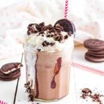 Oreo Frappuccino on table with cookies.