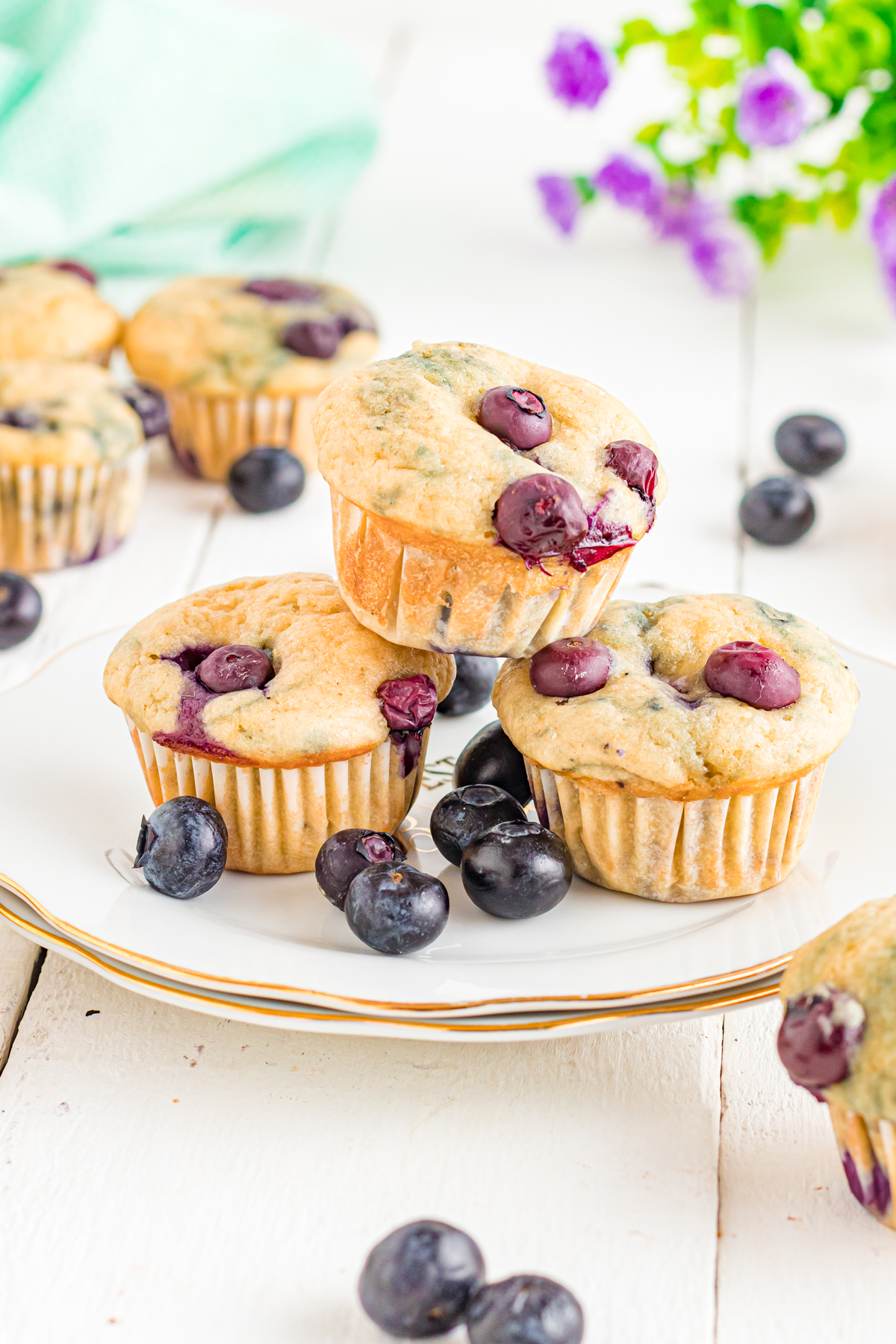 Mini blueberry muffins on a plate.