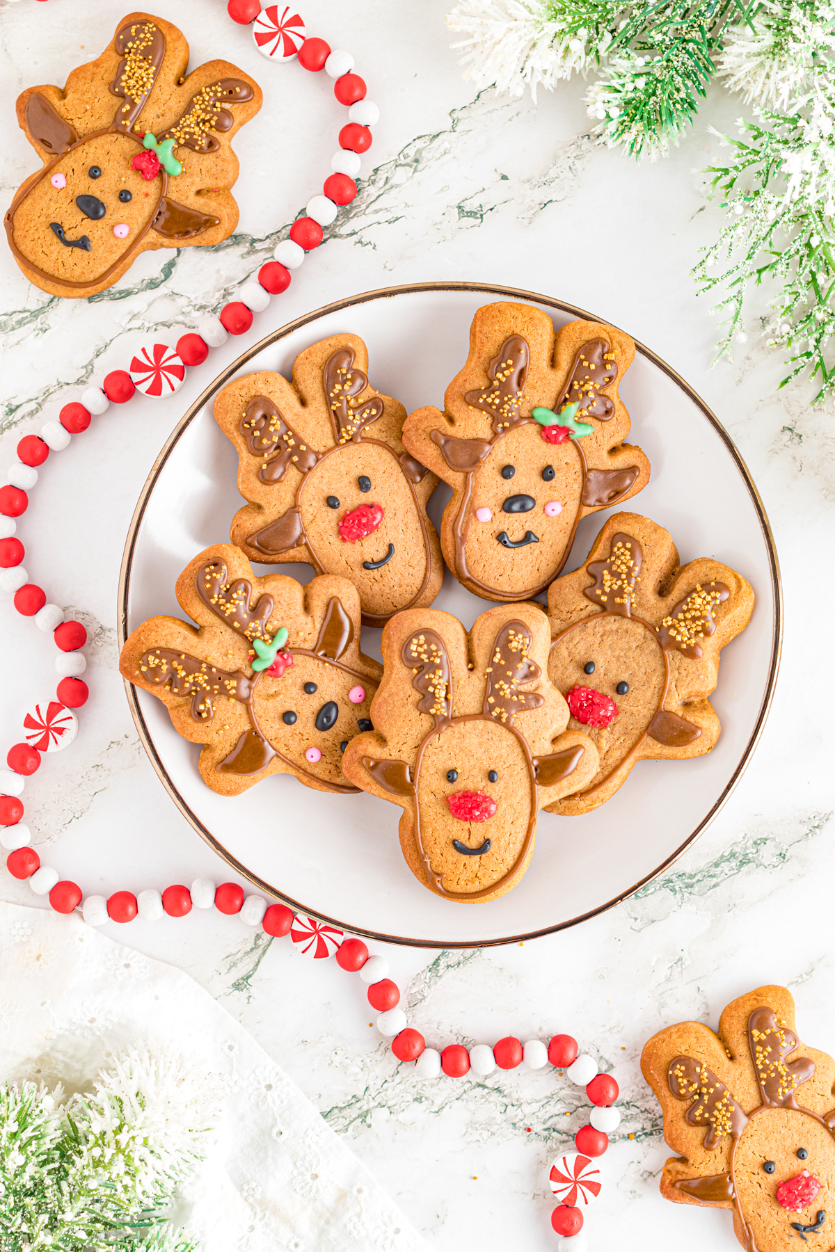 Gingerbread Reindeer Cookies on a plate on the counter.