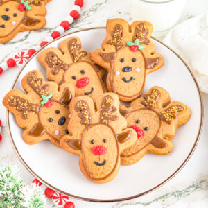 Gingerbread reindeer cookies on a plate.