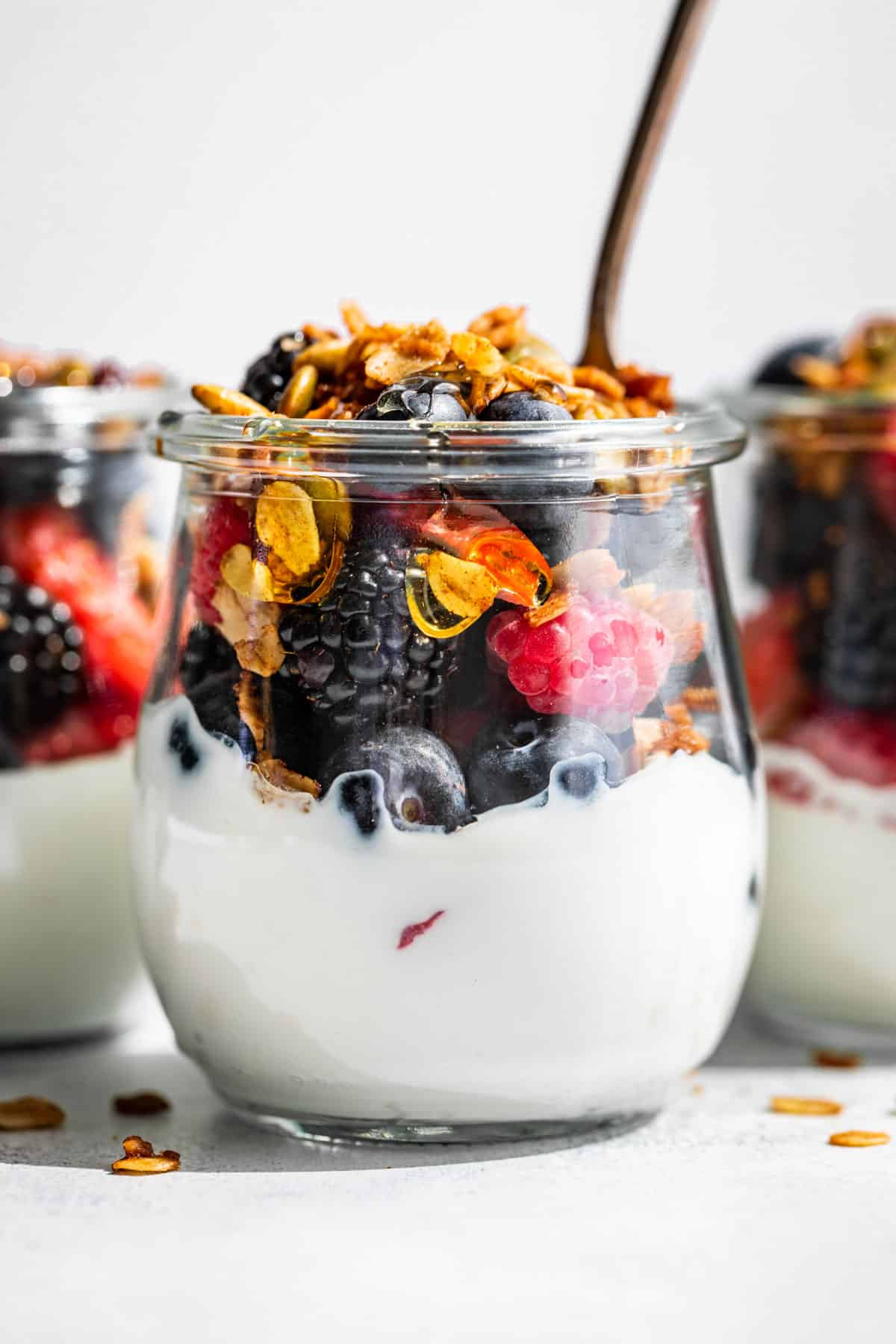 Fruit parfait topped with granola in a jar.