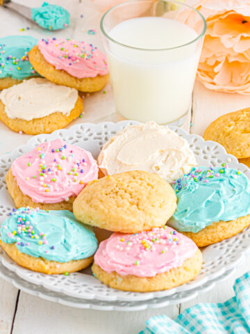 Sour cream Cookies on table with pastel colored buttercream.