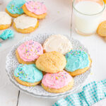 Sour cream Cookies on table with pastel colored buttercream.