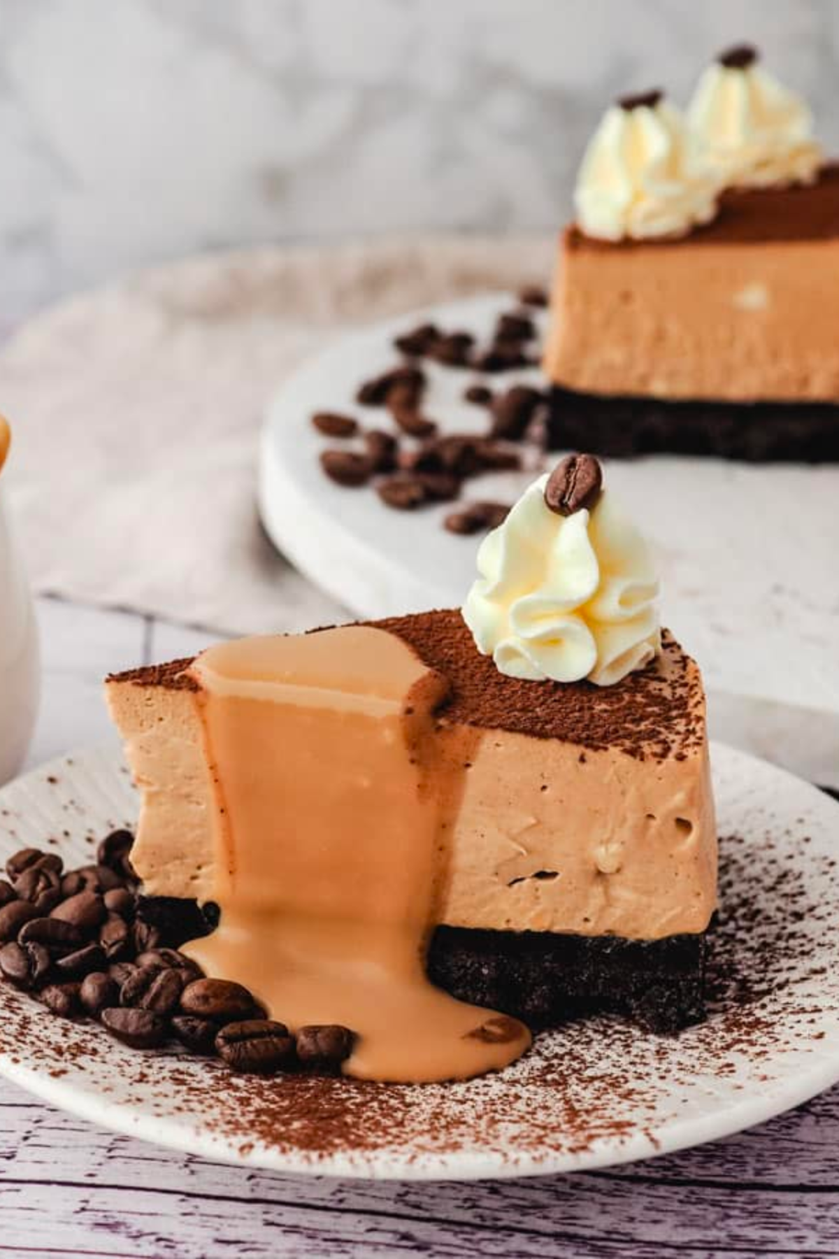 Slice of coffee cheesecake on plate.