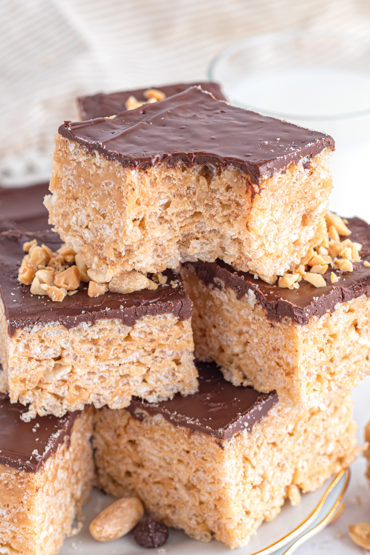 Rice Krispie treats stack, one with bite out.