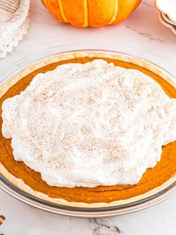 Pumpkin Cream Pie on table in pie plate.