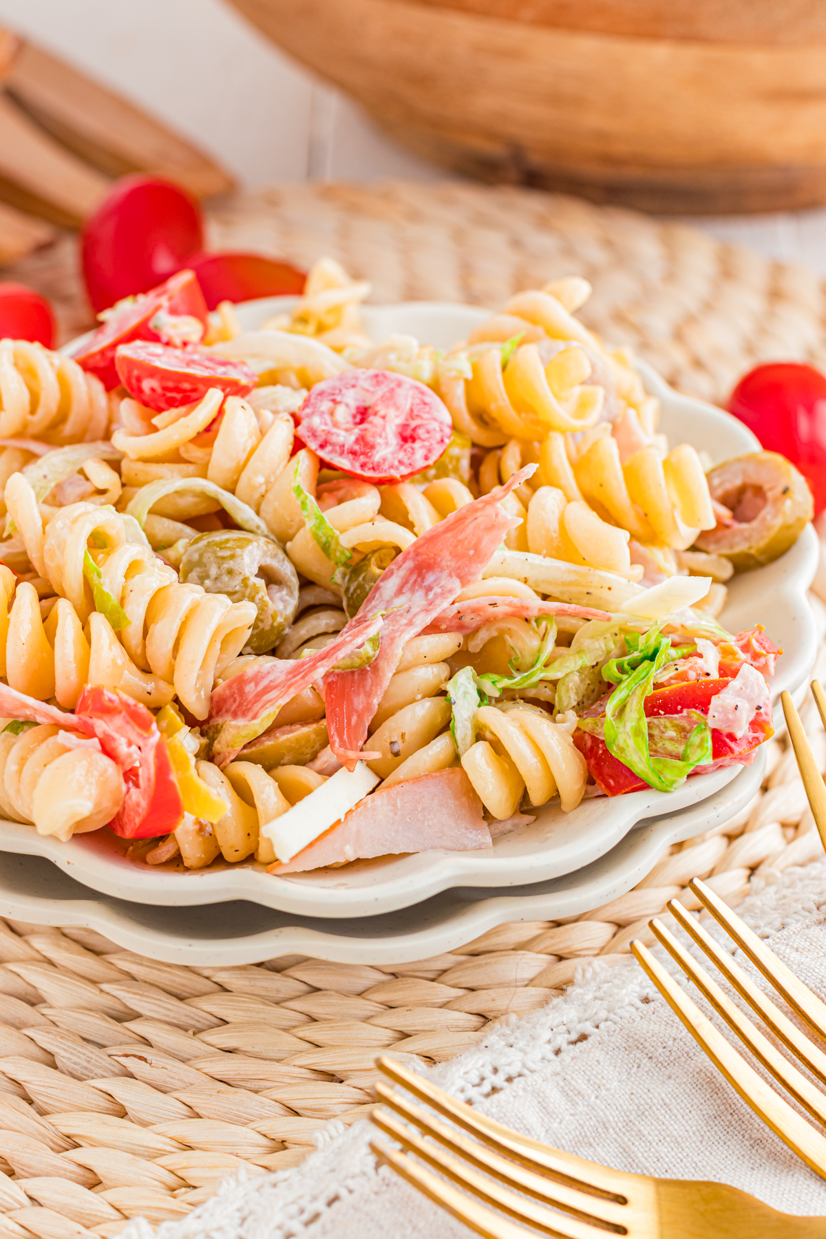The Grinder Pastasta Salad on a plate with a pulse on the table with Fork Forks.