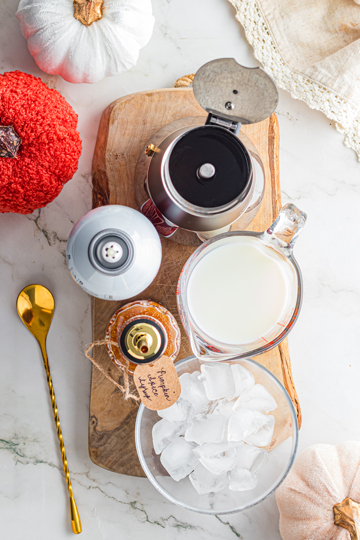 Ingredients to make iced powk spice latte.