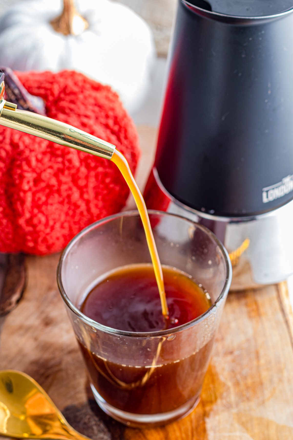 Pouring thigh syrup in espresso.