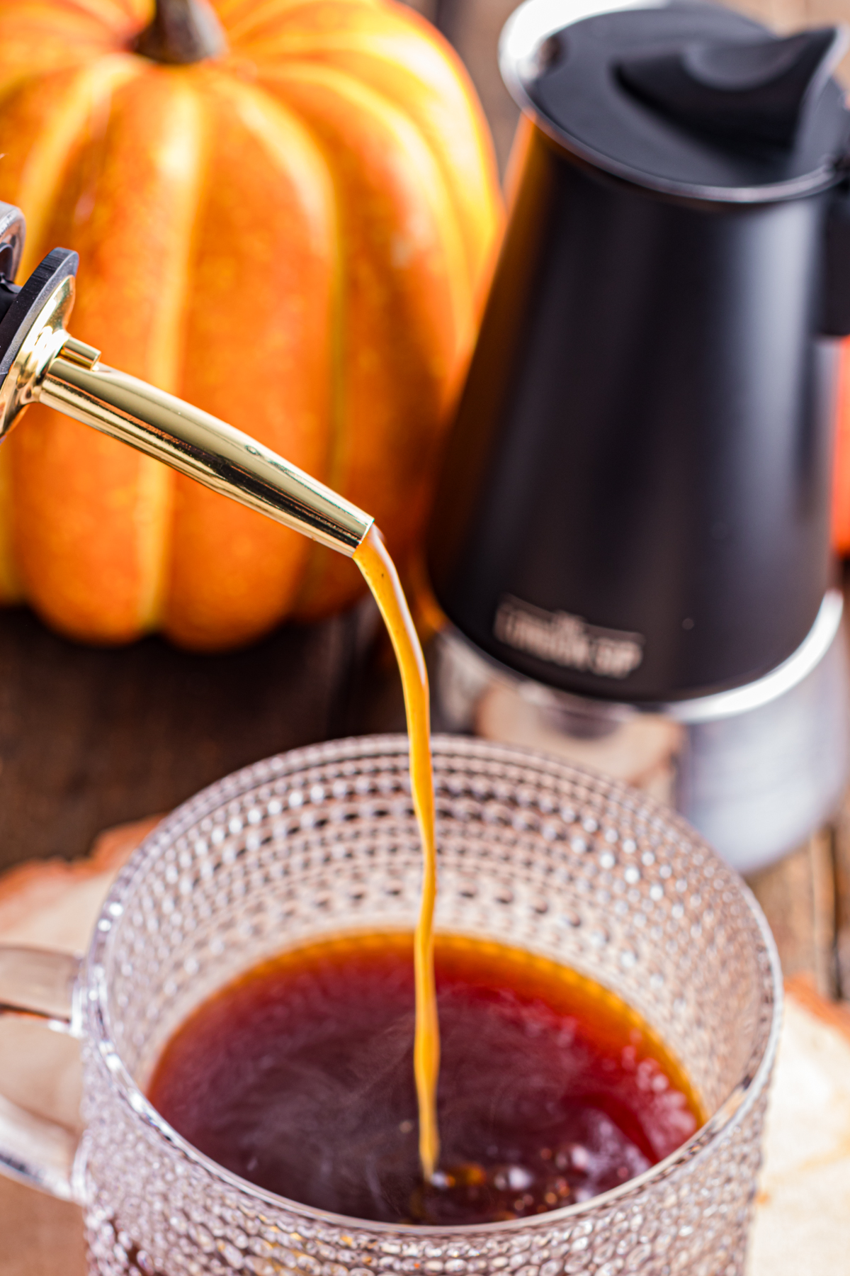 Pumpkin Spice syrup on a mug with espresso.