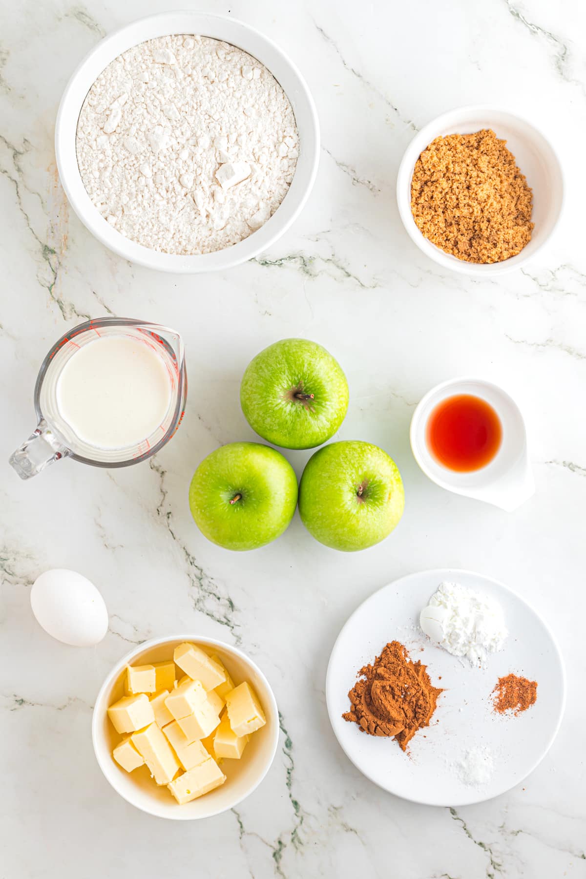 Ingredients to make cinnamon apples on the counter top.