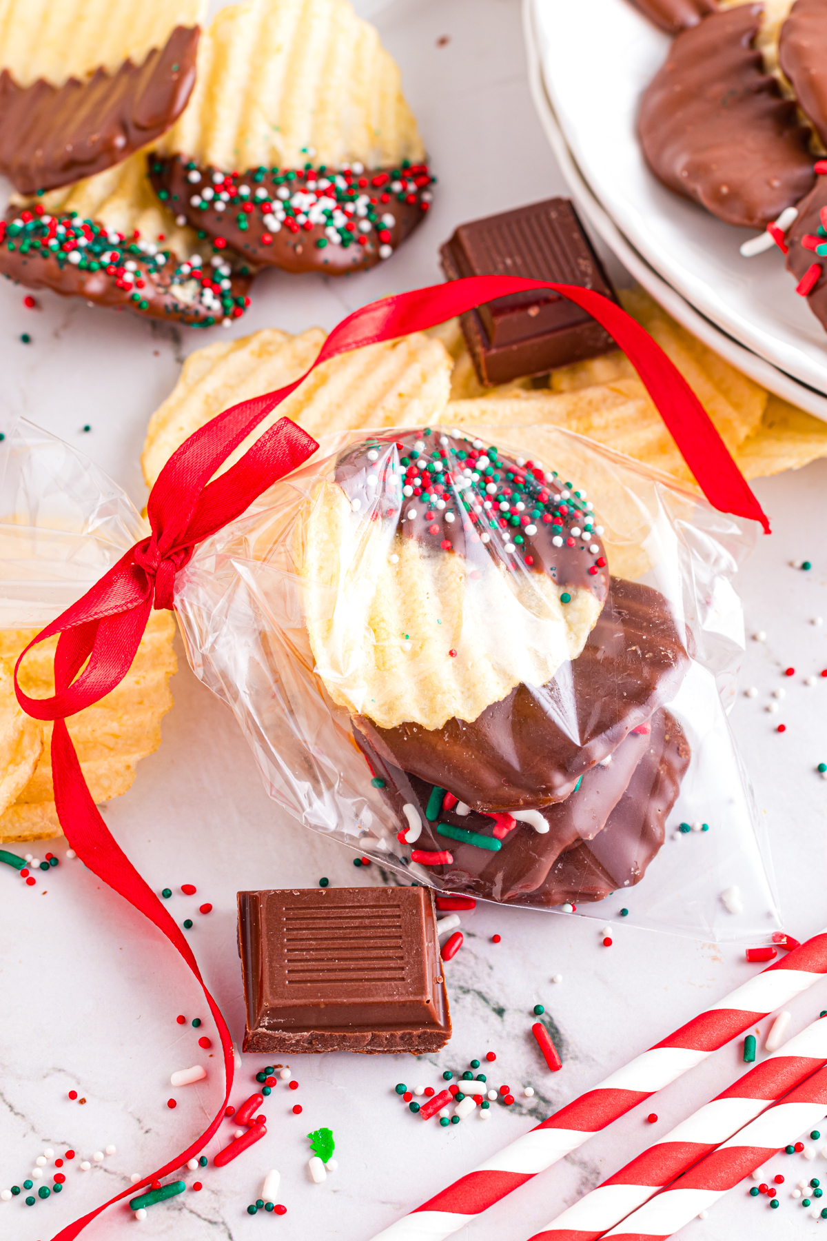 Chocolate dipping potato chips wrapped in cellonane bags with ribbon.