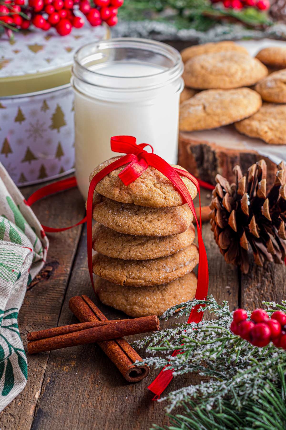 Gingersnap cookies are assembled and wrapped with red satin ribbon.