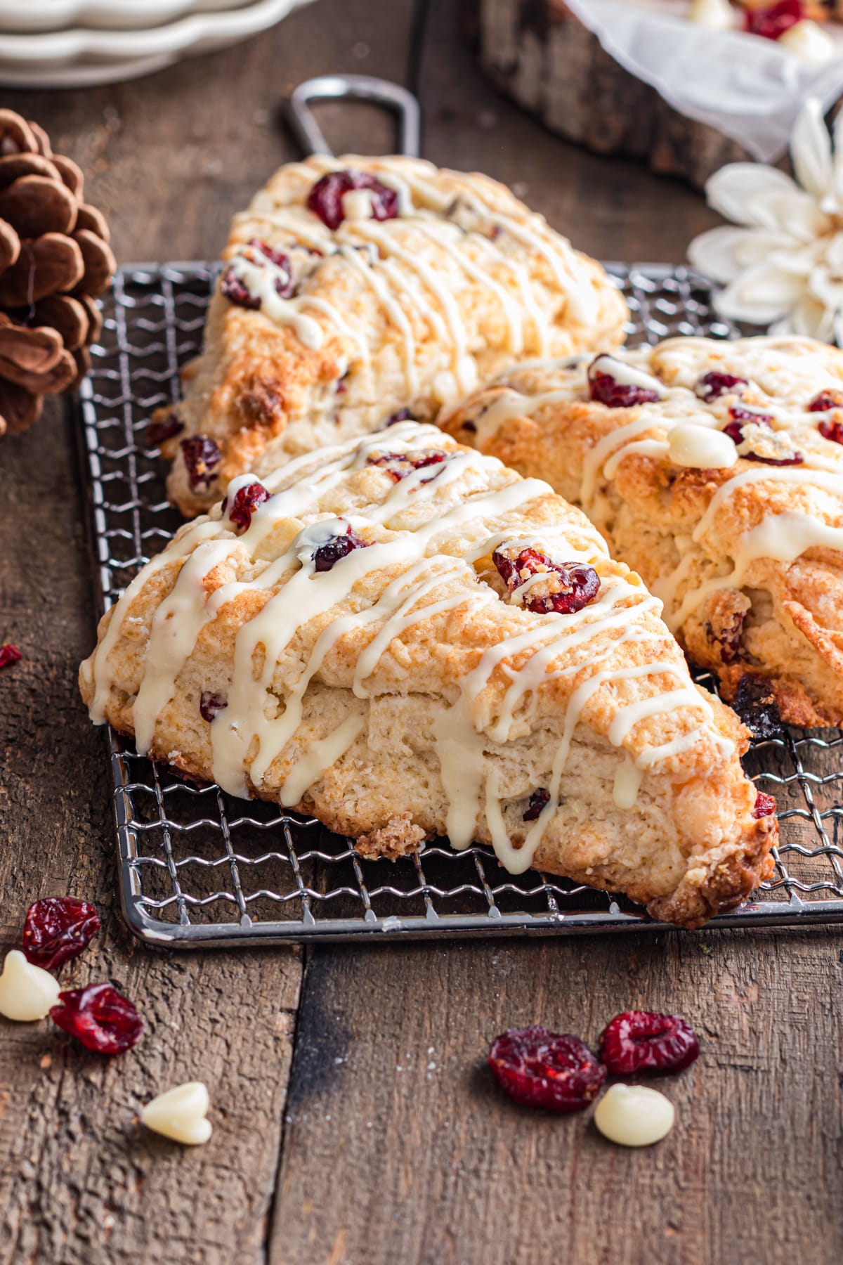 Cranberry white chocolate scones ona cooling rack.