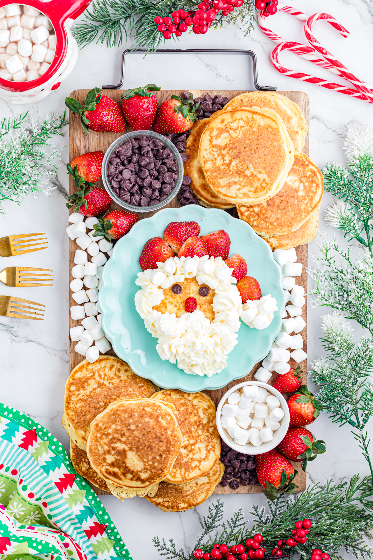 Build your own santa pancakes station. Set up on a charcuterie board with toppings.
