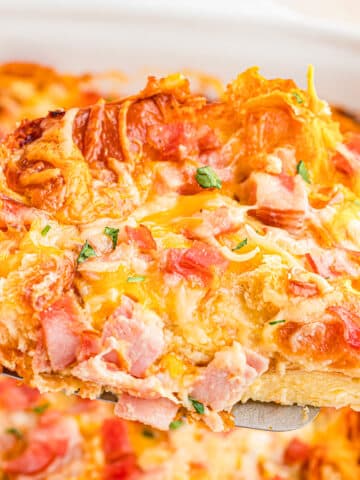 Ham and cheese croissant bake on spatula.