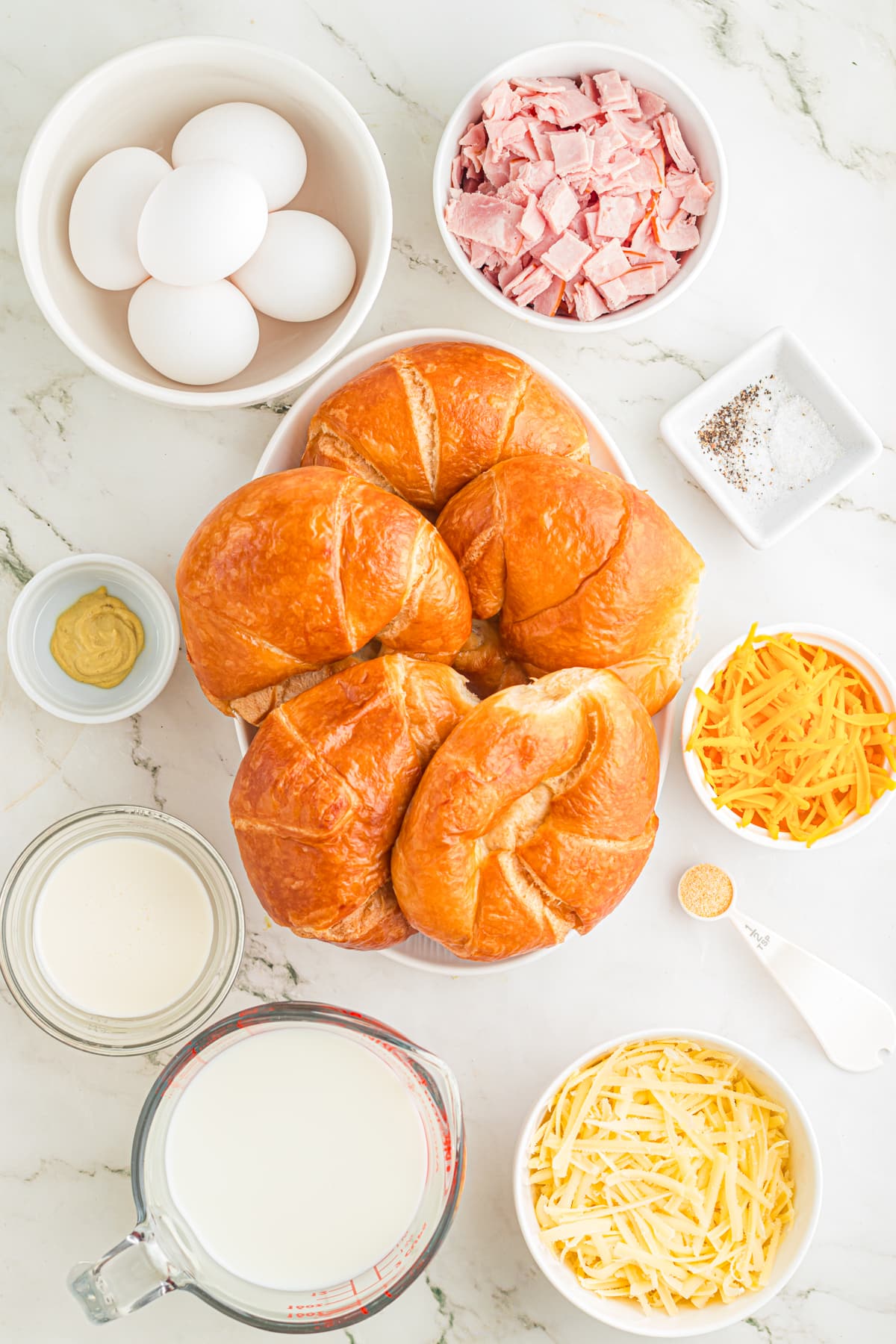 Ingredients for ham and cheese croissant bake.