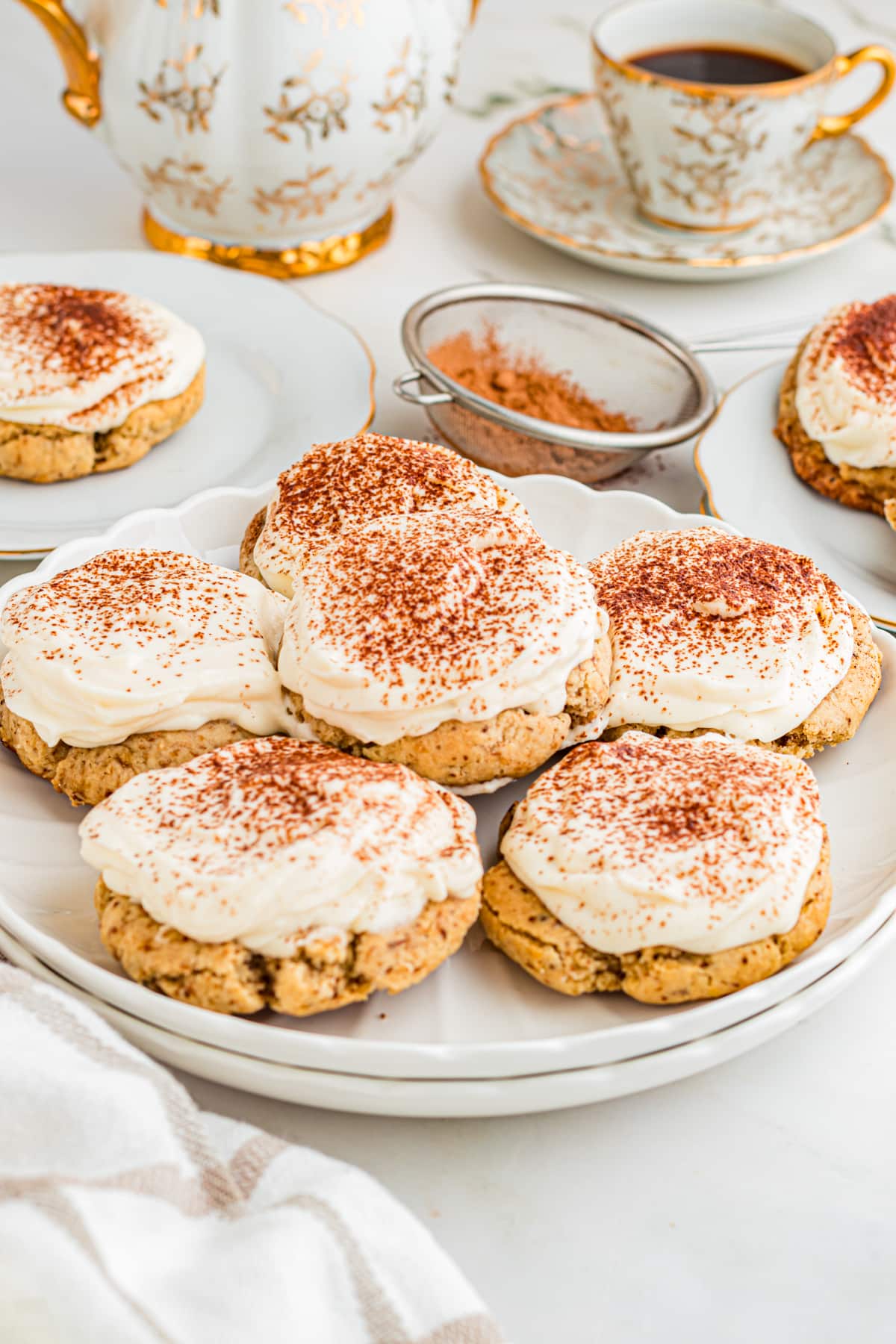 Tiramisu cookies on table with cup of espresso.